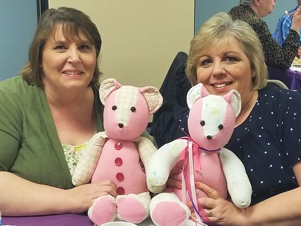 Two women hold their Memory Bears