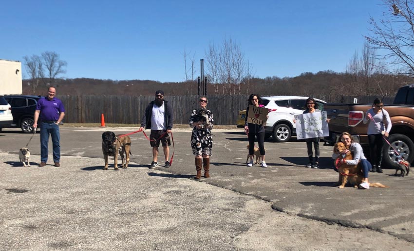 The VITAS team with their pets outside a Connecticut assisted living facility