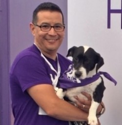 Alex Silva with a Paw Pals puppy